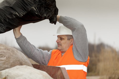 Operatives wearing PPE while working on garden clearance